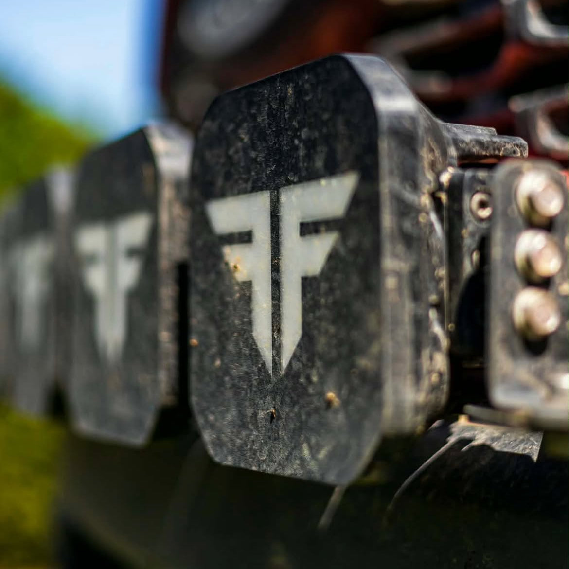 Custom logo covers on Diode Dynamics pod lights mounted on a truck bumper